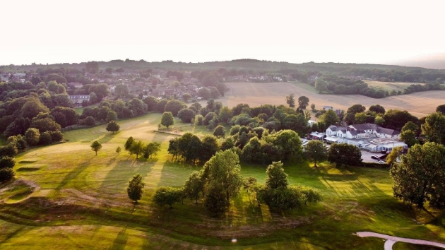 Sky view of the countryside and a large white building