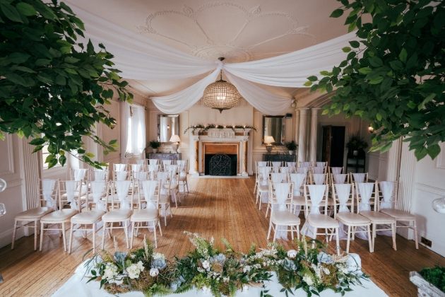 A large room with chairs lining an aisle